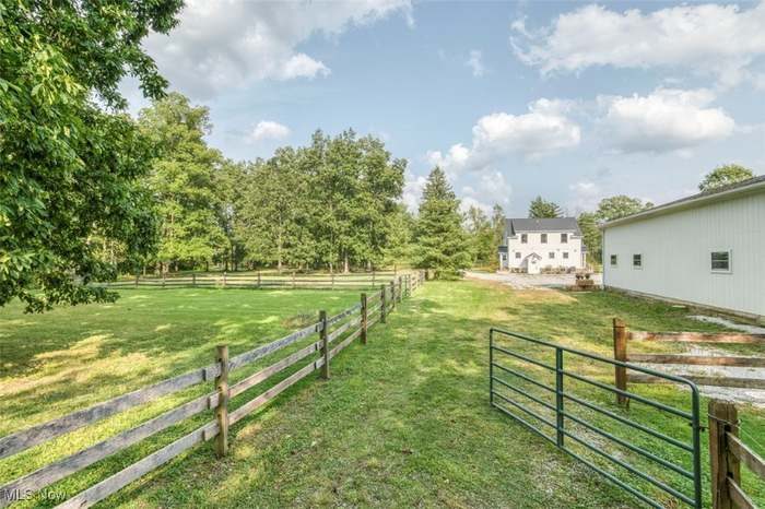 Fenced pasture at Hickory Grove with the farmhouse in the distance
